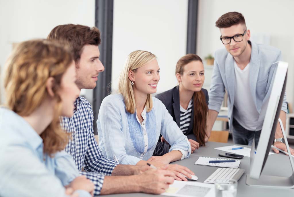 A group of people sitting around a table.