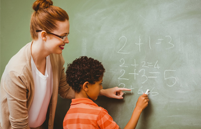 A woman and boy writing on the wall